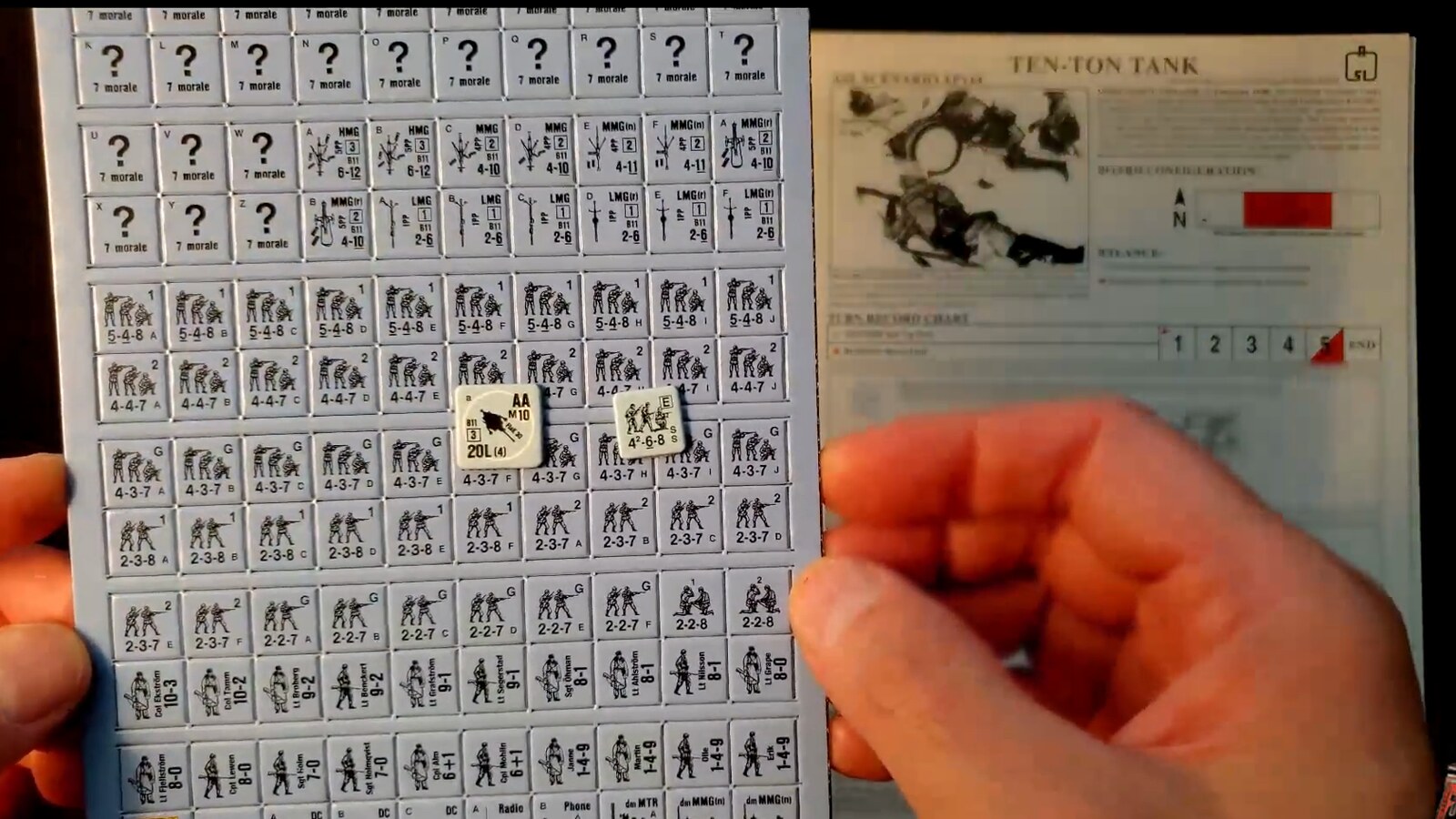 The Swedish counter sheet with two German counters set on it to compare the shades of blue, next to the Ten-Ton Tank scenario card